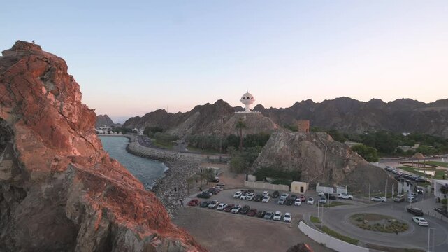 Riyam Incense Burner Monument in Muscat, Oman at Sunset with Mountainous Backdrop