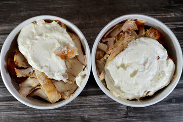 Chicken shawarma shake, made of pieces of chicken shawerma with tomeya garlic sauce and fried French potatoes fingers, all mixed together, Syrian cuisine of roasted chicken cut into thin slices