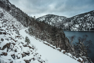 Snow covered carriage trail in winter in Acadia National Park