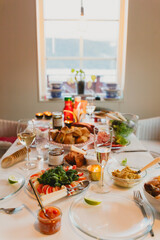 Festive Dinner Table with Appetizers and Drinks