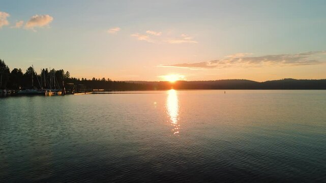 Summer sunset flying over a lake
