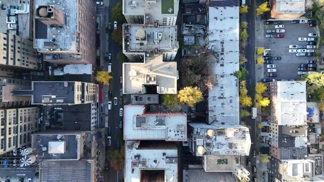 Horizontal drone footage showcasing a top-down view of 325 W 45th St, New York. Captures the busy urban streets, building rooftops, and vibrant city life from an aerial perspective.