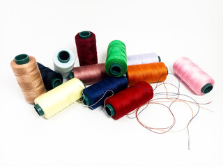 nylon sewing thread in roll form, various colors of sewing thread isolated on white background, suitable for textile industry product catalog design