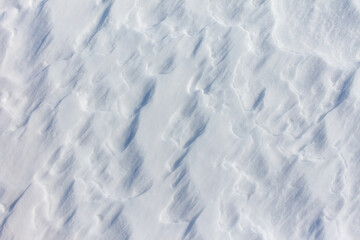 The snow is white and the ground is covered in it