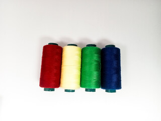 nylon sewing thread in roll form, various colors of sewing thread isolated on white background, suitable for textile industry product catalog design