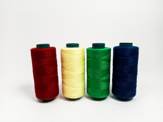 nylon sewing thread in roll form, various colors of sewing thread isolated on white background, suitable for textile industry product catalog design
