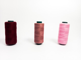 nylon sewing thread in roll form, various colors of sewing thread isolated on white background, suitable for textile industry product catalog design