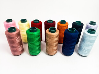 nylon sewing thread in roll form, various colors of sewing thread isolated on white background, suitable for textile industry product catalog design