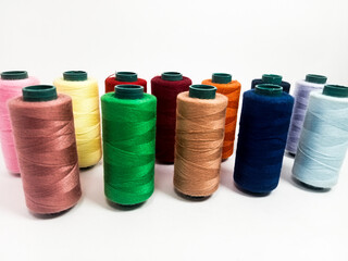 nylon sewing thread in roll form, various colors of sewing thread isolated on white background, suitable for textile industry product catalog design