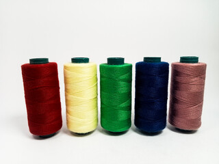 nylon sewing thread in roll form, various colors of sewing thread isolated on white background, suitable for textile industry product catalog design