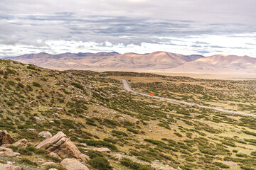 Landscape of western Tibet around Kailash mountain, cloudy sky with copy space