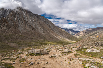Fototapeta premium Pilgrims walking during the journey around Mount Kailash