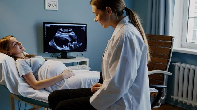 Expecting parents experience first ultrasound in warm, welcoming clinic setting