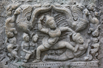 Decorative engraving of ancient tribes on a rock in the Danish zoo