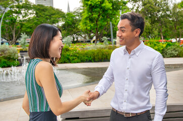 Business meeting between two asian business man and woman