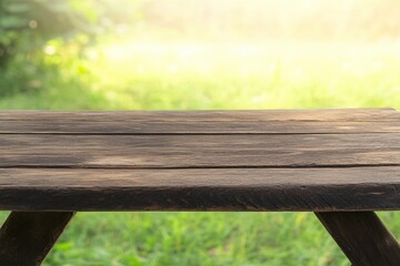 Naklejka premium Rustic Wooden Table on Green Grass Background in Soft Natural Light