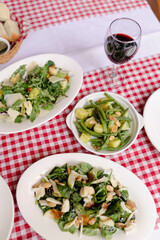 Mixed Salad with Parmesan, Green Bean Potato Salad, Bread Basket, and Red Wine