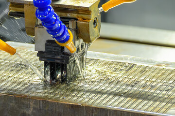 The EDM machine working with liquid coolant method.