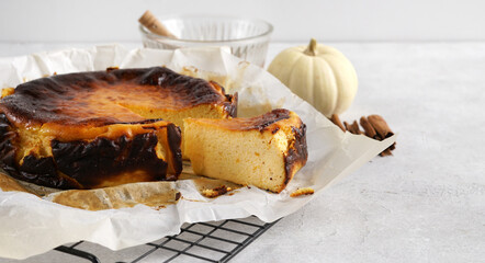 Cut piece of Delicious homemade Pumpkin Basque Cheesecake, copy space