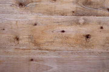 Light brown wood planks with a natural grain pattern are suitable for backdrops, textured layers, rustic designs and woodworking themes