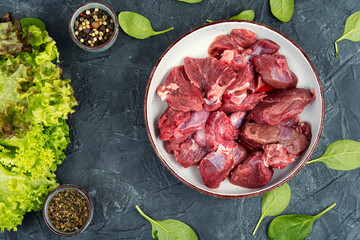 Sliced raw venison deer meat for a stew.