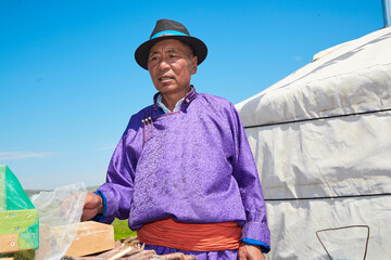 The process of brewing Mongolian milk tea using traditional techniques in a yurt