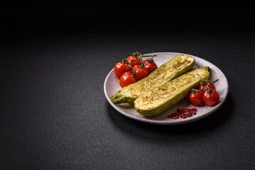 Delicious zucchini cut into two halves baked with salt, spices and herbs