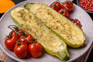 Delicious zucchini cut into two halves baked with salt, spices and herbs