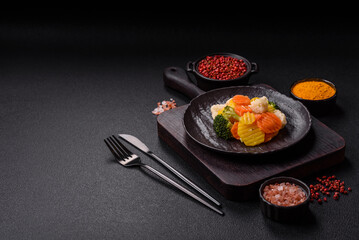 Delicious fresh vegetables steamed carrots, broccoli, cauliflower