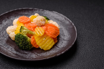 Delicious fresh vegetables steamed carrots, broccoli, cauliflower