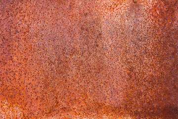 The rusty iron surface is old and rough.