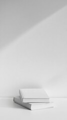 Elegant Stack of Blank White Books on a White Surface
