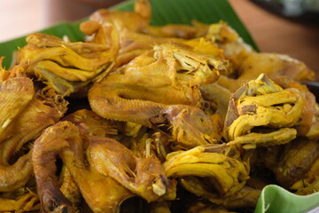yellow braised chicken. turmeric fried chicken. Indonesian food. ayam ungkep kuning. ayam goreng kunyit.