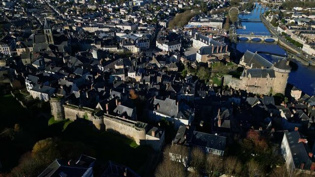 Castle and South Bastion with Mayenne river, Laval cityscape, France. Aerial drone ascending and cityscape