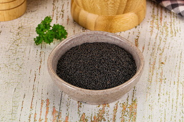 Black dry Nigella seeds in the bowl