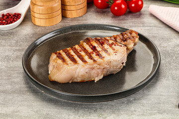 Grilled pork loin steak with bone