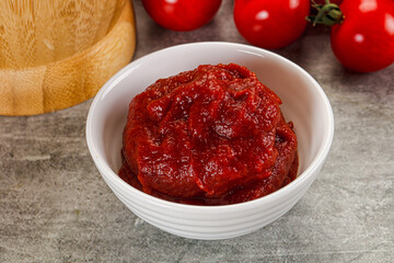 Red tomato paste in the bowl