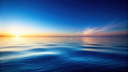 Fototapeta premium Serene Sunset Over a Calm Ocean, Painting the Horizon with Hues of Gold and Lavender