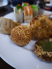 Sesame balls, dumplings, and sushi creating a diverse culinary scene all you can eat