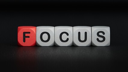 wooden cube block with FOCUS business word.close up of wooden elements,Business Concept.3D rendering on black background.