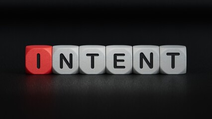wooden cube block with INTENT business word.close up of wooden elements,Business Concept.3D rendering on black background.