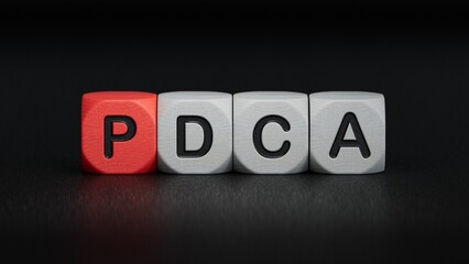 wooden cube block with PDCA business word.close up of wooden elements,Business Concept.3D rendering on black background.