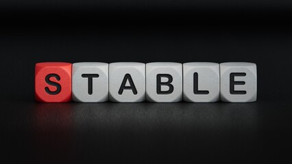 wooden cube block with STABLE business word.close up of wooden elements,Business Concept.3D rendering on black background.