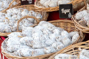 Variety of homemade dried salami sausages in French butchery shop, Dordogne, France, meat food background close up