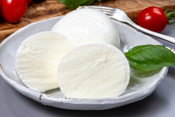 Tasty italian food, fresh white buffalo mozzarella soft cheese balls from Campania close up
