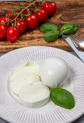 Tasty italian food, fresh white buffalo mozzarella soft cheese balls from Campania close up