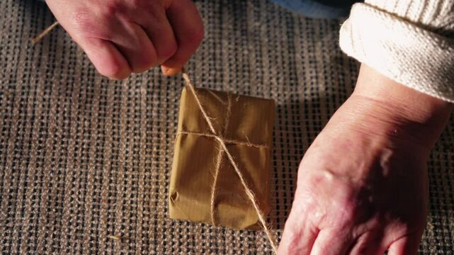 Wrapping gift in brown paper