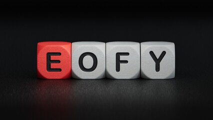 eofy word on wooden cubes.close up of wooden elements,Business Concept.3D rendering on black background.