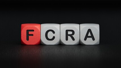 FCRA was created from wooden cubes. Finance and Banking.close up of wooden elements,Business Concept.3D rendering on black background.