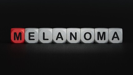 The hand puts a wooden cube with the letter melanoma. The word is written on wooden cubes.close up of wooden elements,Business Concept.3D rendering on black background.